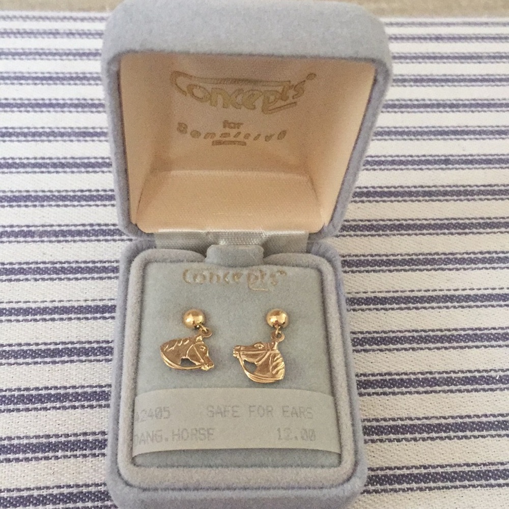 Gold tone, dangling earrings.